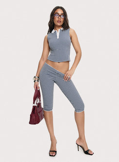 front view of model wearing Princess Polly Tuka Capri Navy Gingham Mid Rise Pants 