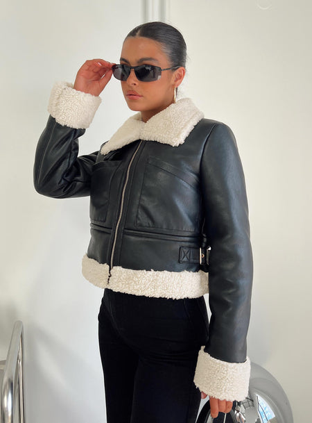 Jacket Faux leather, shearling material on inside and outside, classic collar, twin chest pockets, twin buckle detail at sides-adjustable Zip fastening at front