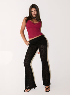 side view of model wearing Princess Polly Gogo Lace Flare Pants Black Mid Rise Pants 