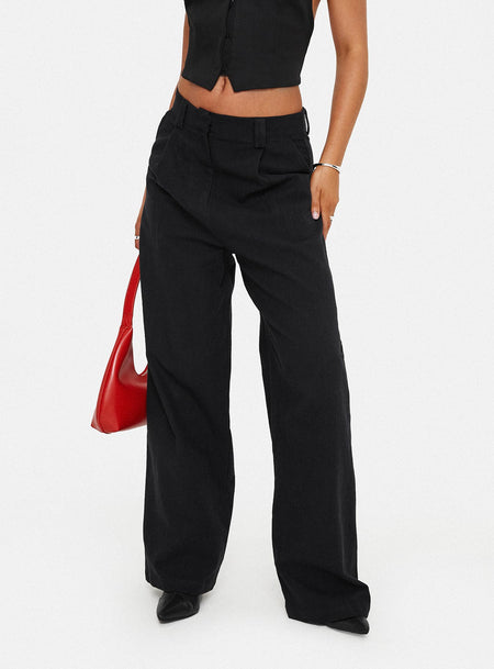 Low-rise linen pants  Zip & clasp fastening, belt looped waist, subtle pleats, twin hip pockets, wide leg Non-stretch material, unlined 