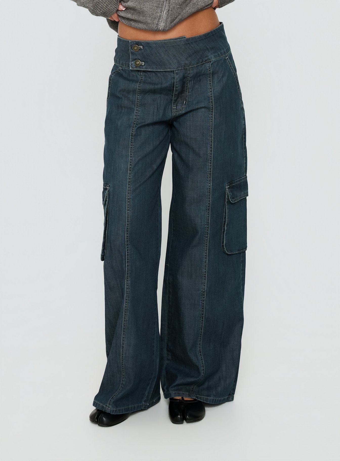 Showcasing the Nikoletta Mid Rise Wide Leg Cargo Jeans Dark Blue Wash in womens-jeans with mid-rise front view of model wearing