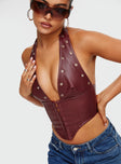 Corset top  Slim fitting, faux leather material , fixed halter neck, plunging neckline, pointed hem Silver-toned eyelets, hook and eye fastening 
