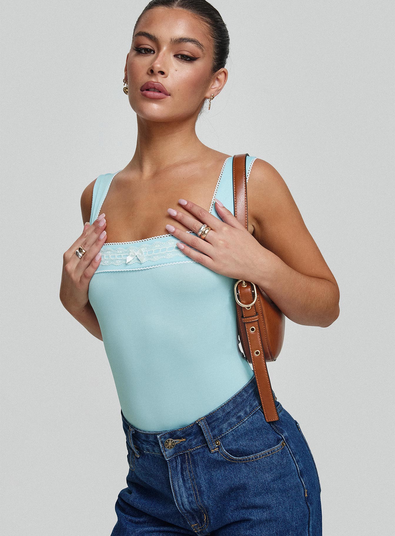 side view of model wearing Princess Polly Keating Bodysuit Baby Blue Sleeveless Square Neck 