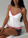 side view of model wearing Princess Polly Sweetness Overload Top White Sleeveless Plunger 