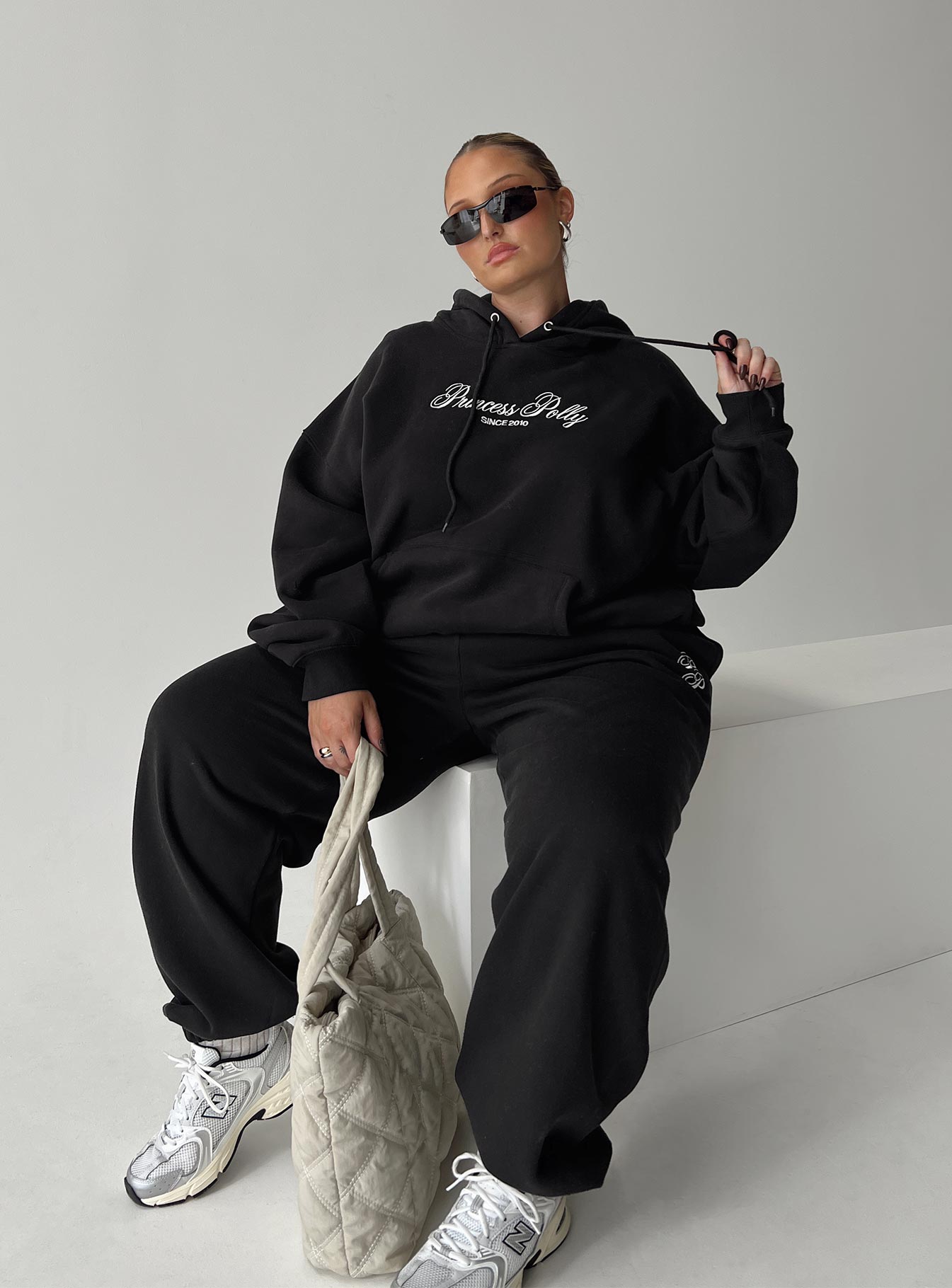 front view of model wearing Princess Polly Princess Polly Track Pants Script Black / Ivory Curve 