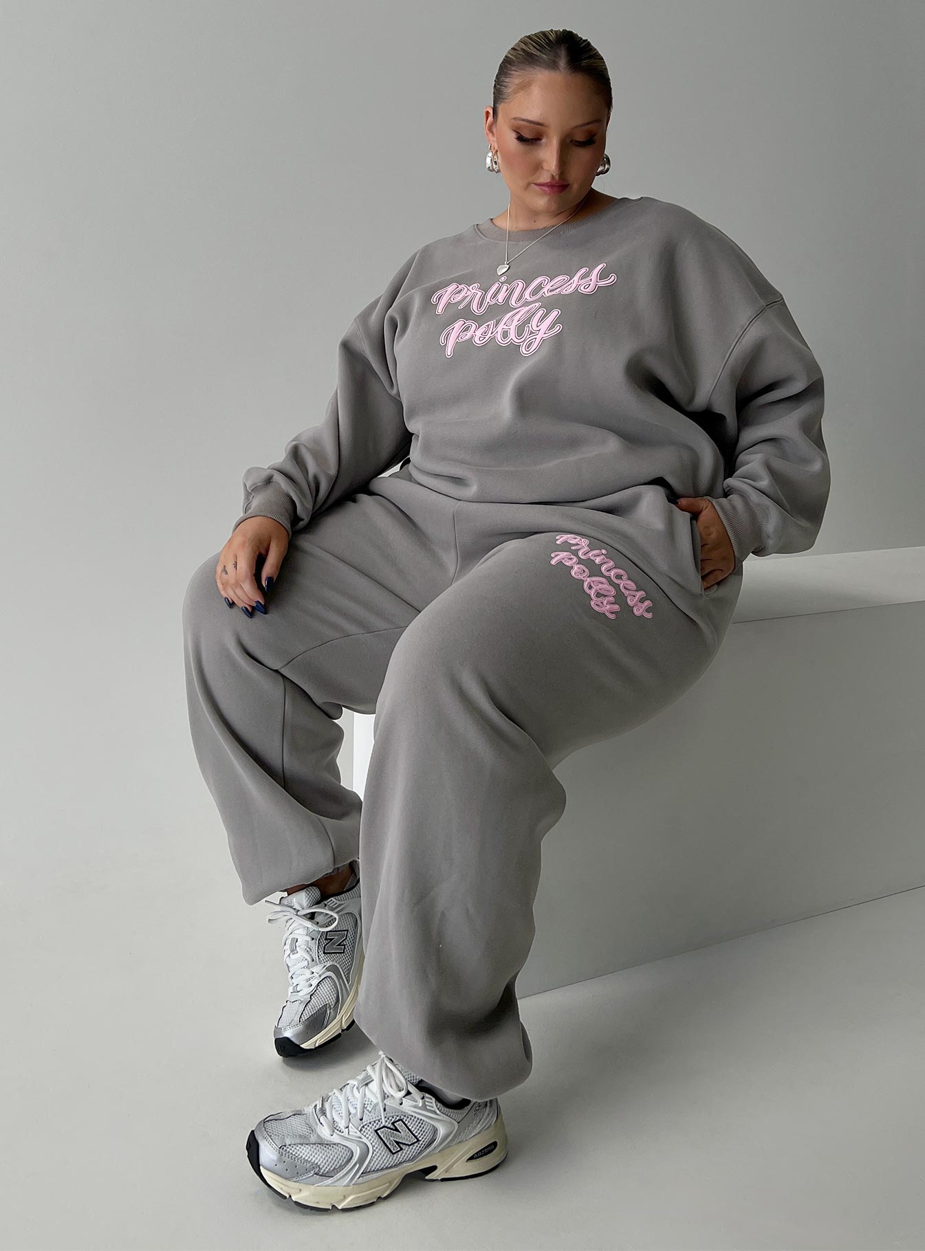 front view of model wearing Princess Polly Princess Polly Track Pants Puff Text Charcoal Curve 