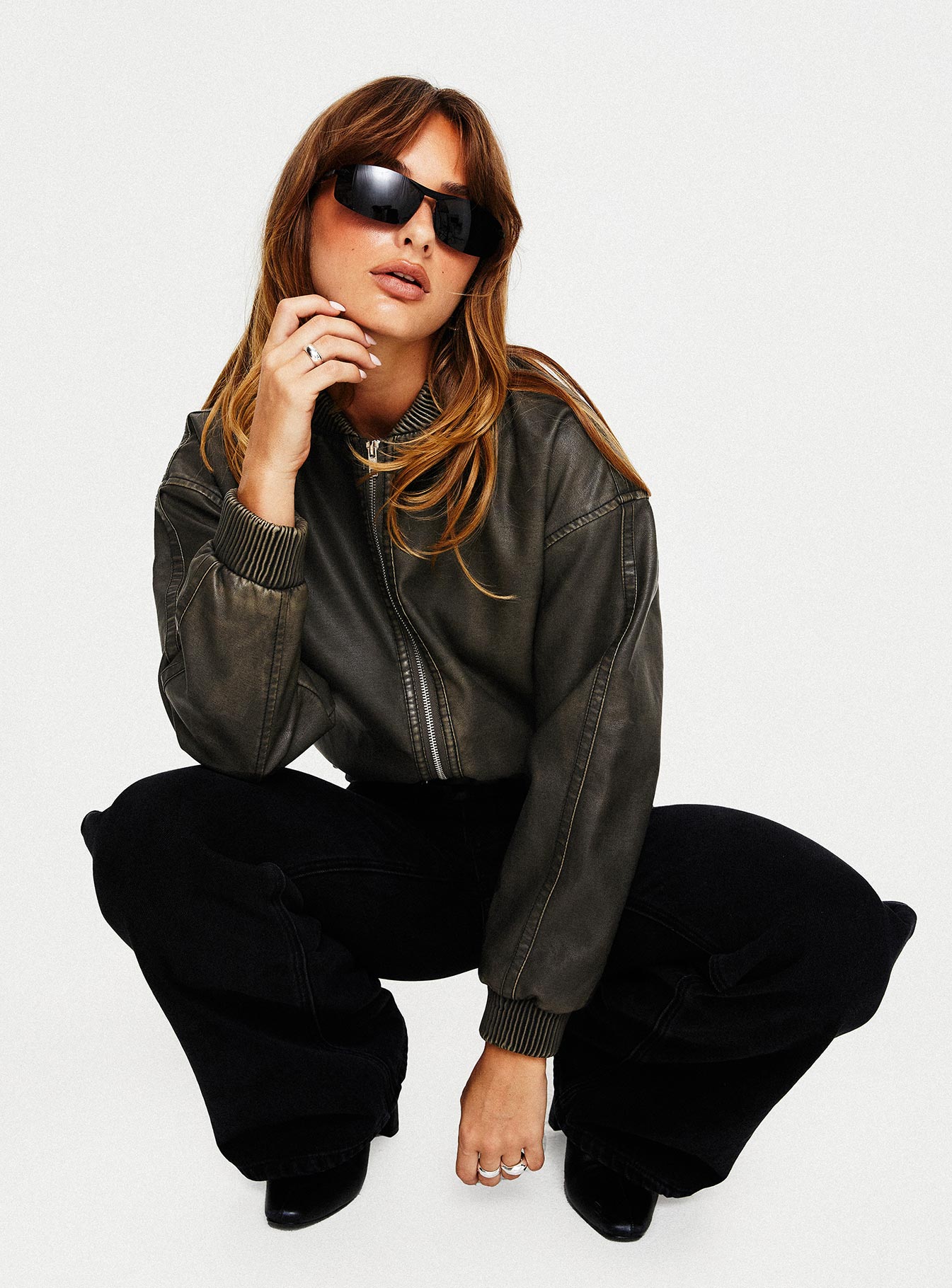 Washed green Faux leather jacket  Drop shoulder, ribbed collar, cuff & hem, twin hip pockets with clasp fastening, zip fastening at the front 