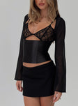 side view of model wearing Princess Polly Bolda Long Sleeve Corset Top Black Full Sleeves Square Neck 