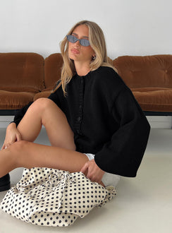 side view of model wearing Princess Polly Edern Cardigan Black regular 