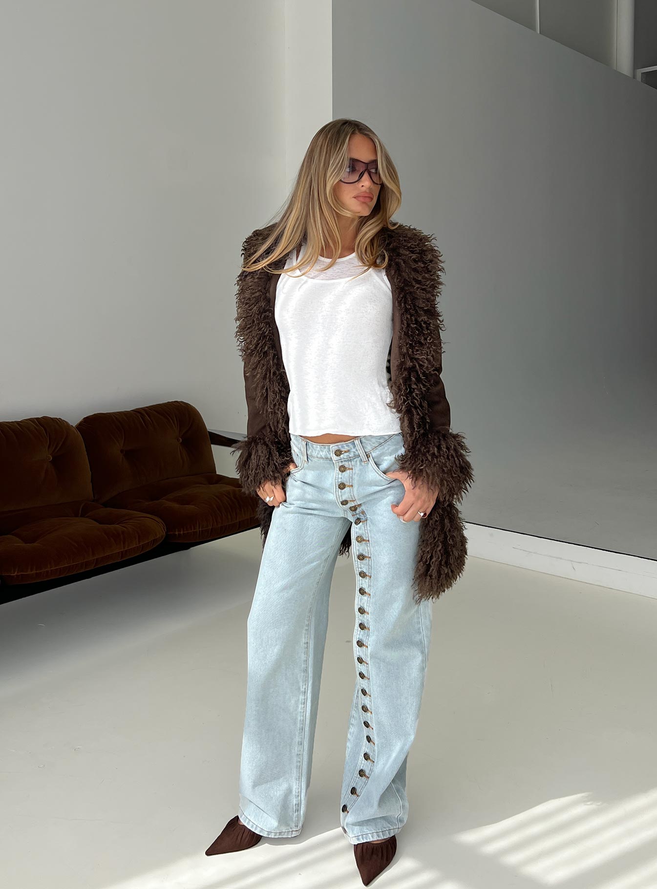 side view of model wearing Princess Polly Penny Mid Rise Straight Leg Jeans Light Denim Low Rise Jeans 