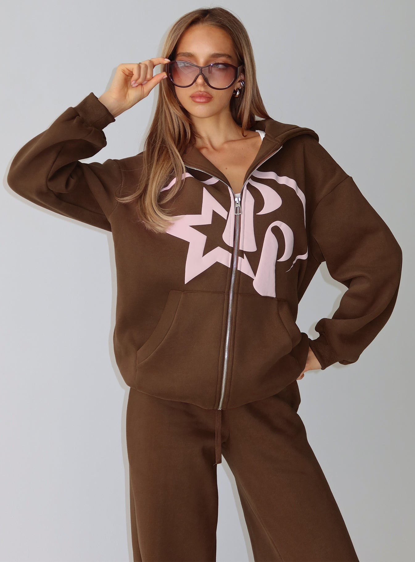 side view of model wearing Princess Polly Princess Polly Stargirl Zip Through Jumper Brown Longline Jumpers 