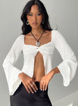 Long sleeve top Twist detail at bust, inner silicone strip at bust, split hem, flared sleeve Good stretch, lined bust