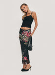   side view of model wearing Princess Polly Paganio Maxi Skirt Black Floral Maxi 