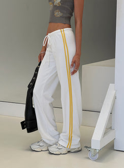 side view of model wearing Princess Polly Elation Low Rise Straight Leg Track Pant White Low Rise Pants 