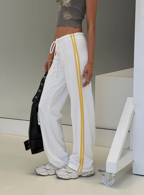 side view of model wearing Princess Polly Elation Low Rise Straight Leg Track Pant White Low Rise Pants 