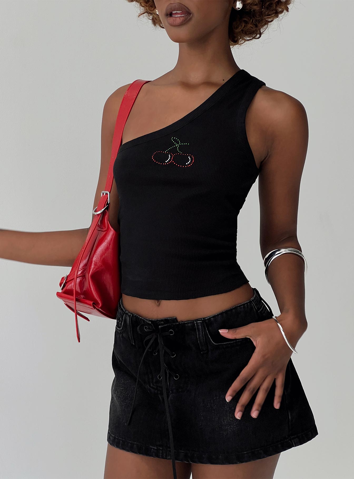 back view of model wearing Princess Polly Amethysta Denim Skort Black Low Rise Shorts 