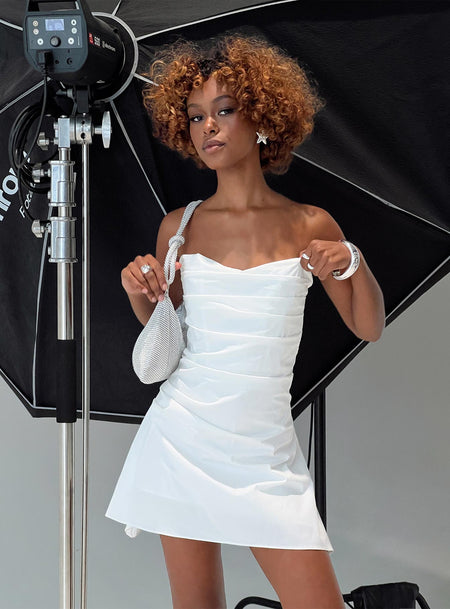Strapless mini dress Boning throughout, invisible zip fastening at back, pleats at bust Non-stretch material, fully lined