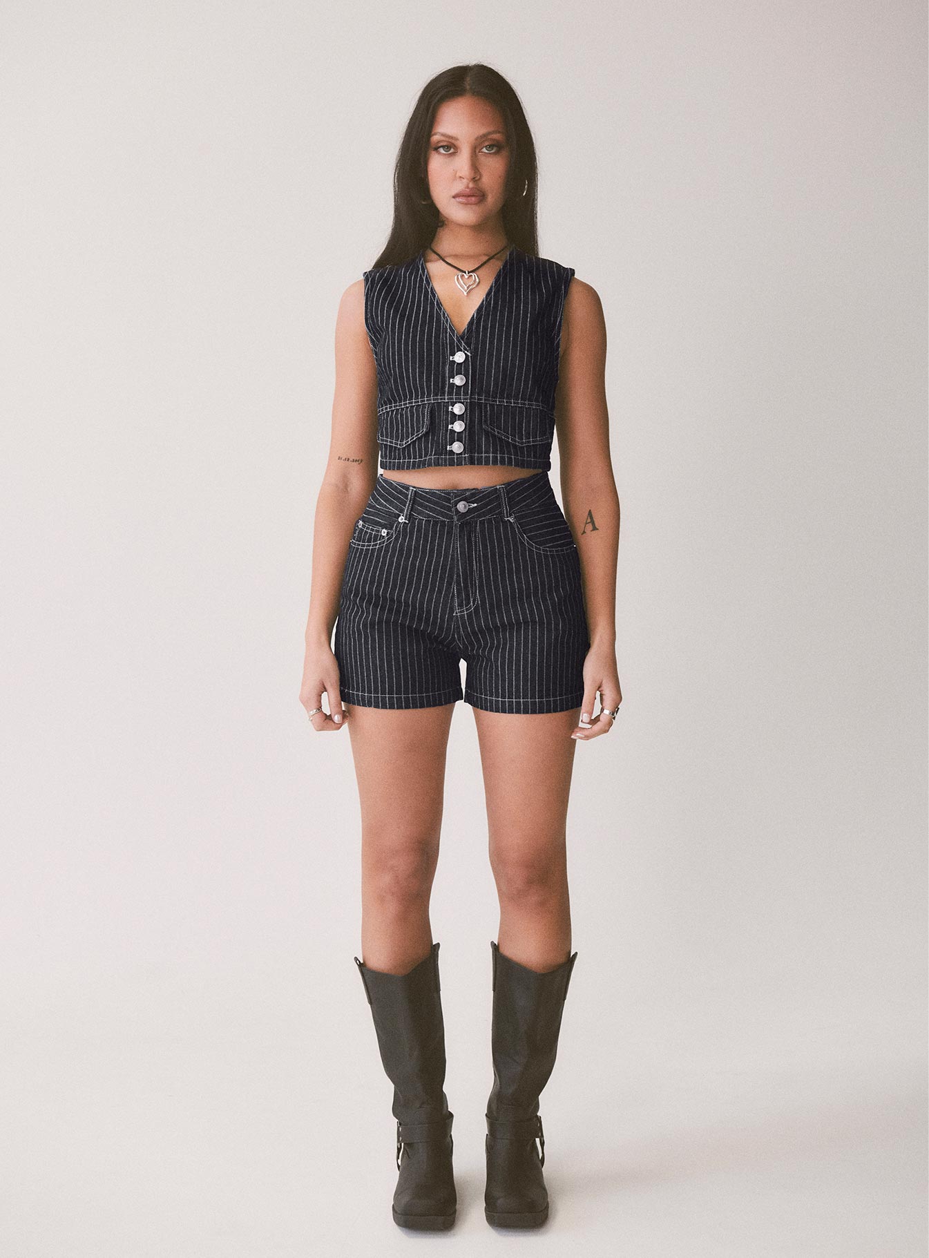 back view of model wearing Princess Polly Rathlyn Pinstripe Shorts Dark Denim High Waisted Shorts 