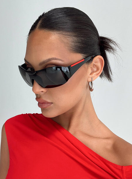 Sunglasses Molded nose bridge, smoke tinted lens, thick arms with red detail