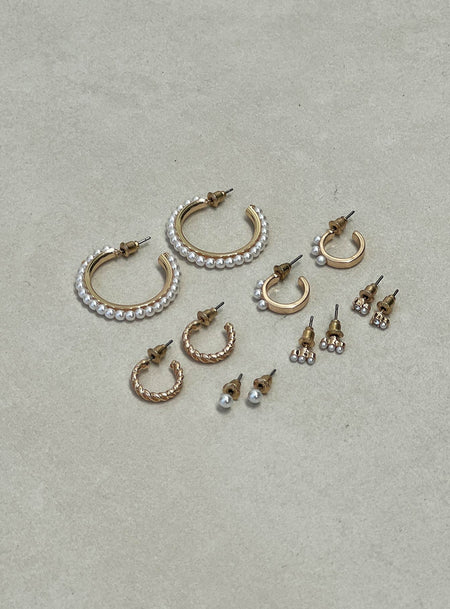 Earring Pack Six pairs of earrings in back, gold-toned, pearl details, each one unique Stud fastening