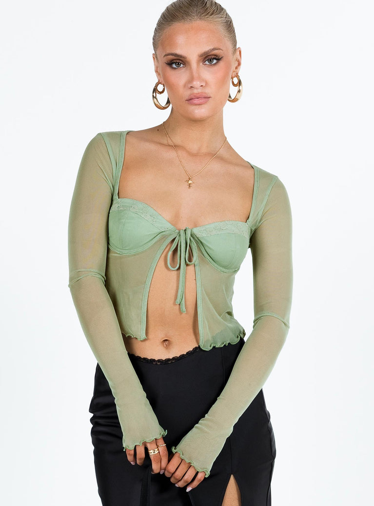 Long sleeve top Sheer mesh material Wide neckline Wired cups Tie fastening at front Elasticated bands at back Lettuce edge hem