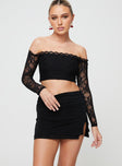 Low rise mini skirt, ruched waistband, slit at side Good stretch, unlined 
