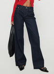 side view of model wearing Princess Polly Jankins Baggy Jeans Dark Blue Wash Mid Rise 