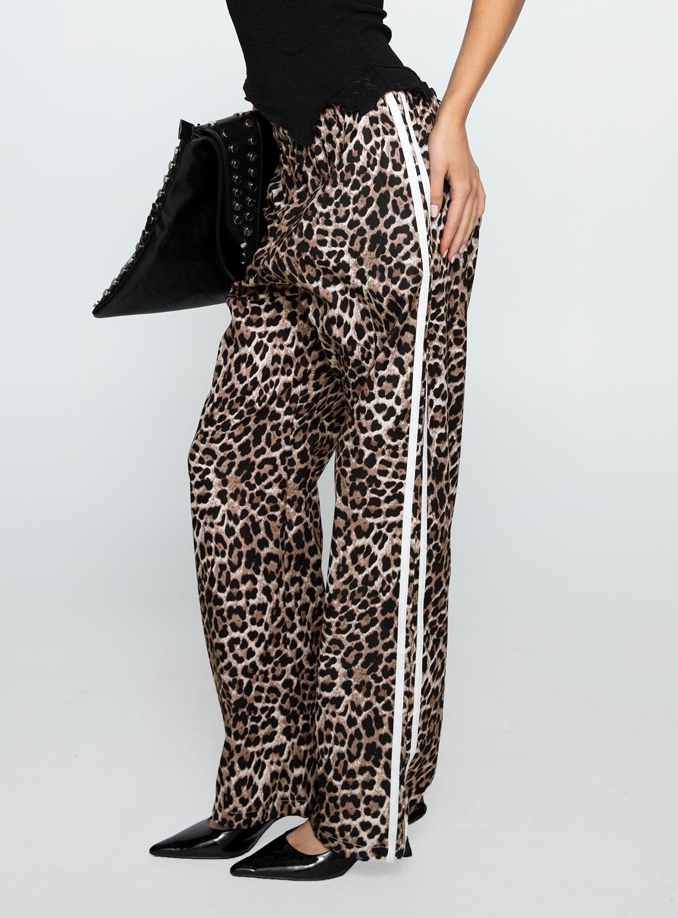 back view of model wearing Princess Polly Buzzer Track Pants Leopard High Waisted Pants 