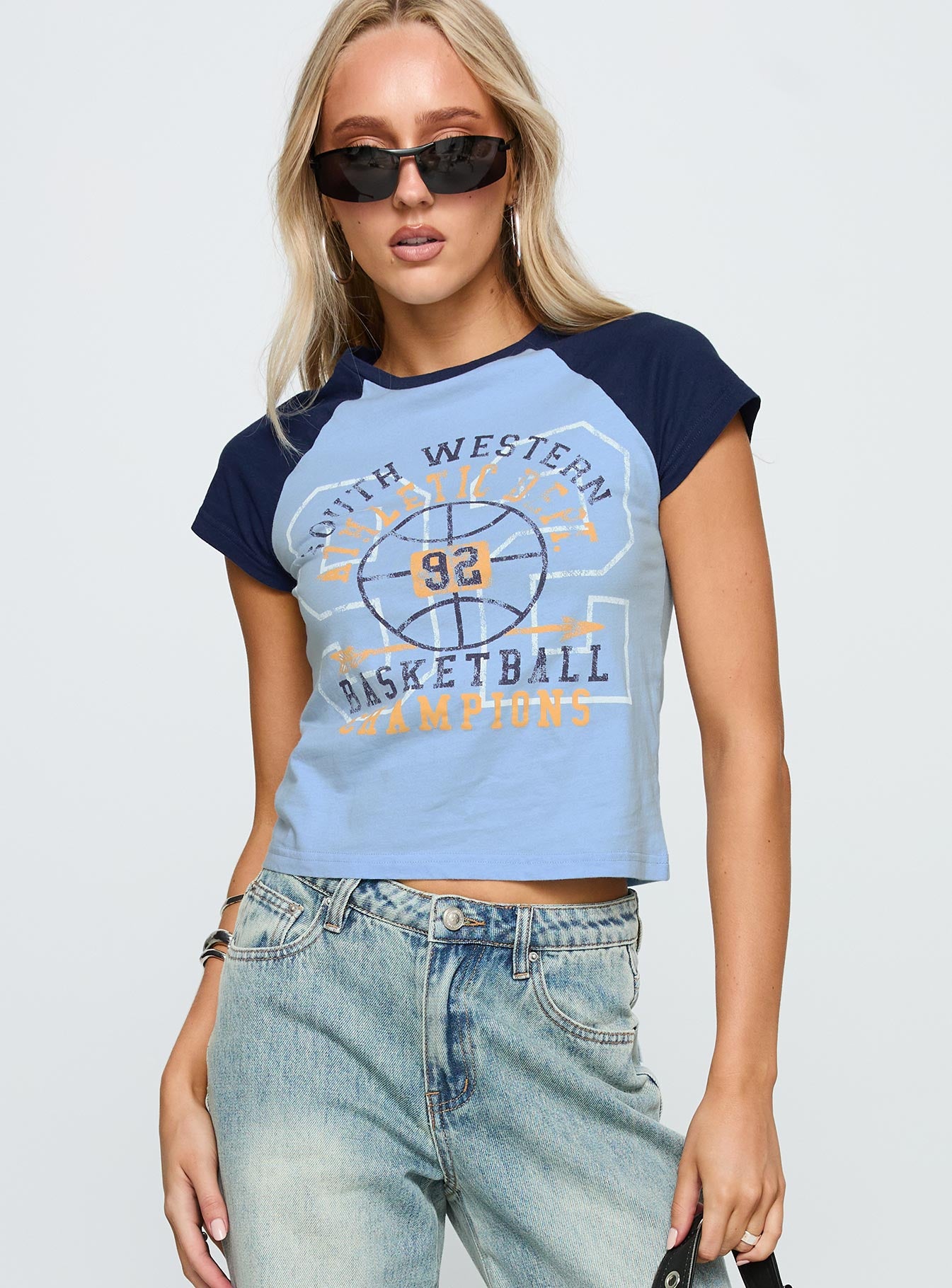 front view of model wearing Princess Polly South West Sports Graphic Top Blue Short Sleeves Crew Neck 