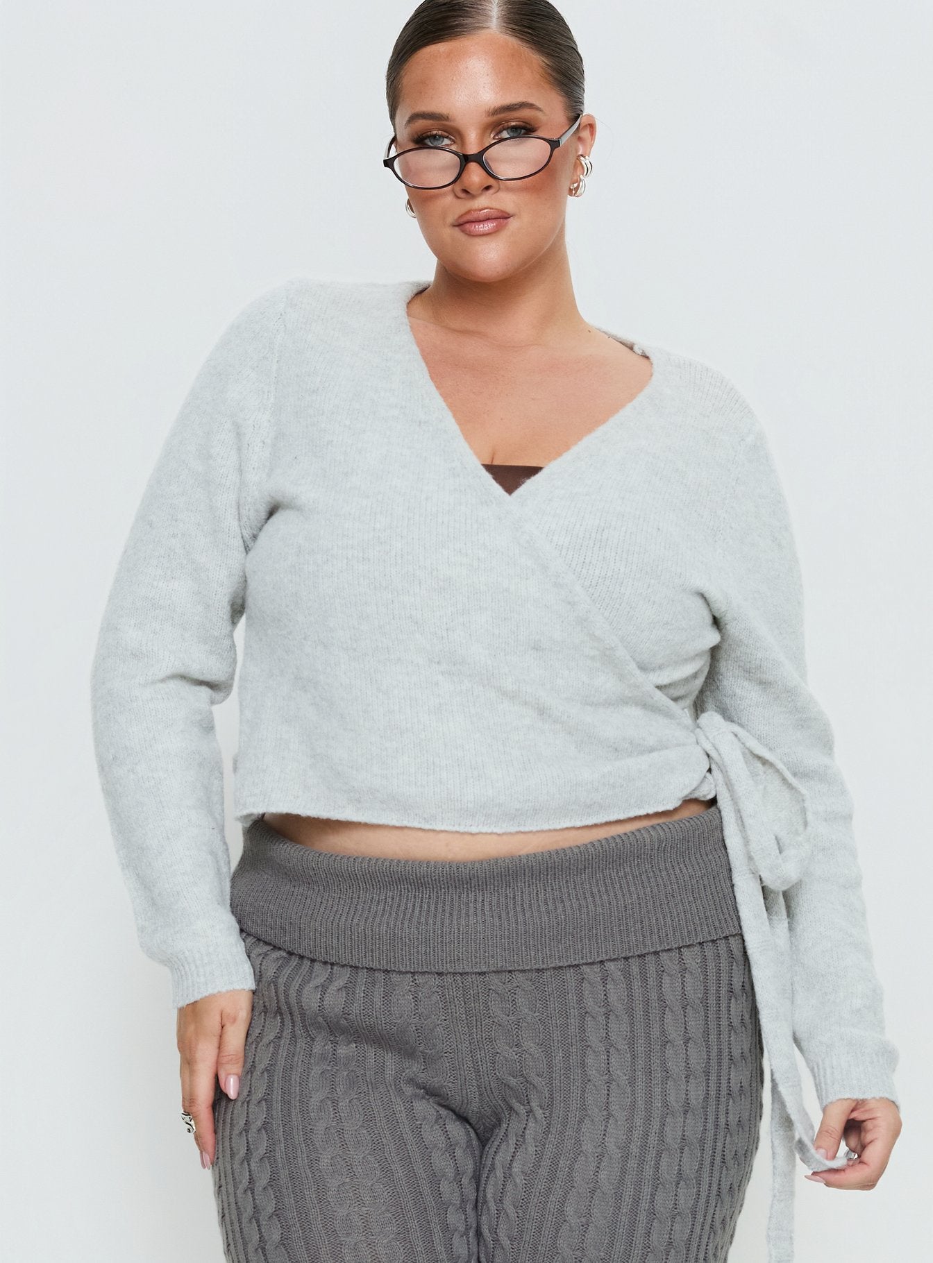 front view of model wearing Princess Polly Tonee Wrap Knit Cardigan Grey Curve cropped 