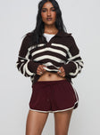 front view of model wearing Princess Polly Moreton Shorts Wine Low Rise Shorts 