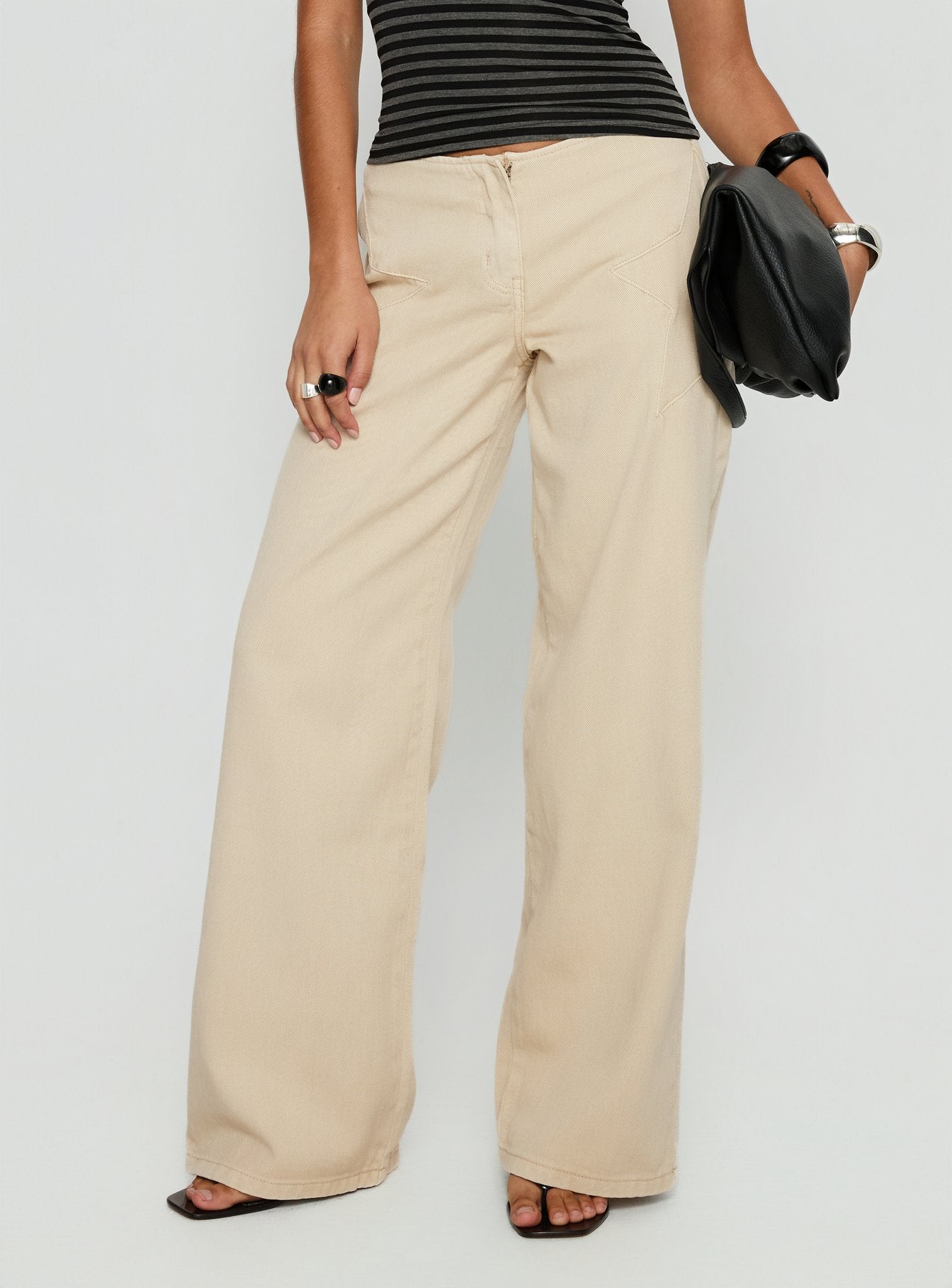 back view of model wearing Princess Polly Dolley Star Stitch Mid Rise Wide Leg Jean Ecru Mid Rise Jeans 