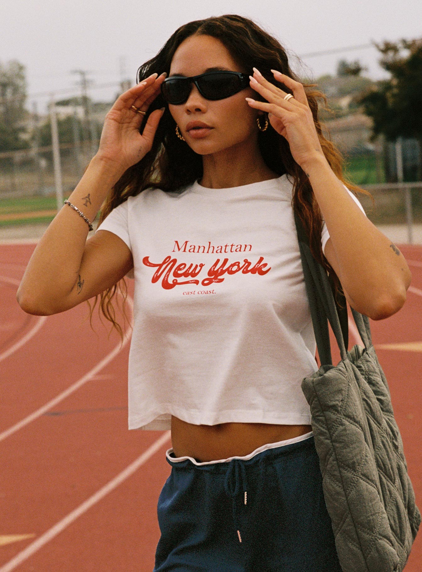 side view of model wearing Princess Polly East Coast Nyc Tee White Short Sleeves Crew Neck 