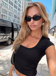 side view of model wearing Princess Polly Baseline Square Neck Rib Top Black Short Sleeves Square Neck 