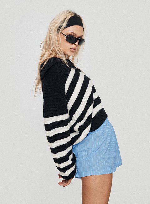 side view of model wearing Princess Polly Maxxy Boxer Shorts Blue Stripe High Waisted Shorts 