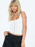 White corset top Sheer lace material Square neckline Hook and eye fastening at front Good stretch Mesh lining