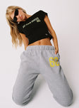 side view of model wearing Princess Polly UCSD Sweatpants Heather Grey High Waisted Pants 