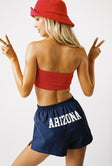 back view of model wearing Princess Polly U of A Soffee Shorts Navy High Waisted Shorts 