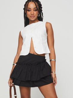 front view of model wearing Princess Polly Selenis Asymmetrical Mini Skort Black High Waisted Shorts 