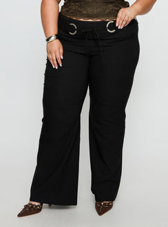 back view of model wearing Princess Polly Twinflame Low Rise Hardware Pants Black Curve Mid Rise Pants 