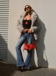 front view of model wearing Princess Polly Iker Flared Jeans Mid Wash Mid Rise 