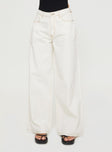 side view of model wearing Princess Polly Naylor Wide Leg Jeans Cream Petite Low Rise Jeans 