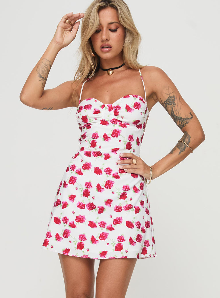 Mini dress Floral print, cross over back detail, invisible zip fastening Non-stretch material, fully lined  Princess Polly Lower Impact 