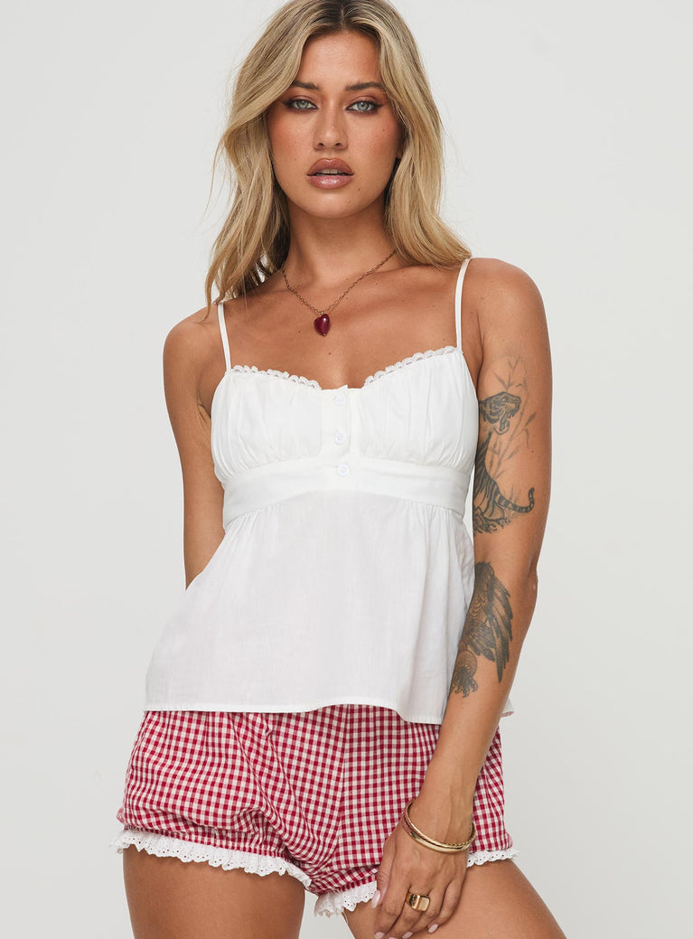 Crop top Adjustable shoulder straps, scooped neckline, lace trim, button detail, invisible zip fastening at side Non-stretch material, lined bust