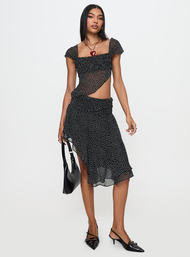   front view of model wearing Princess Polly Legacy Midi Skirt Onyx Polka 