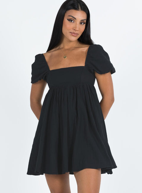 Front view of model wearing  front Princess Polly Square Neck  Lorna Short Sleeve Mini Dress Black