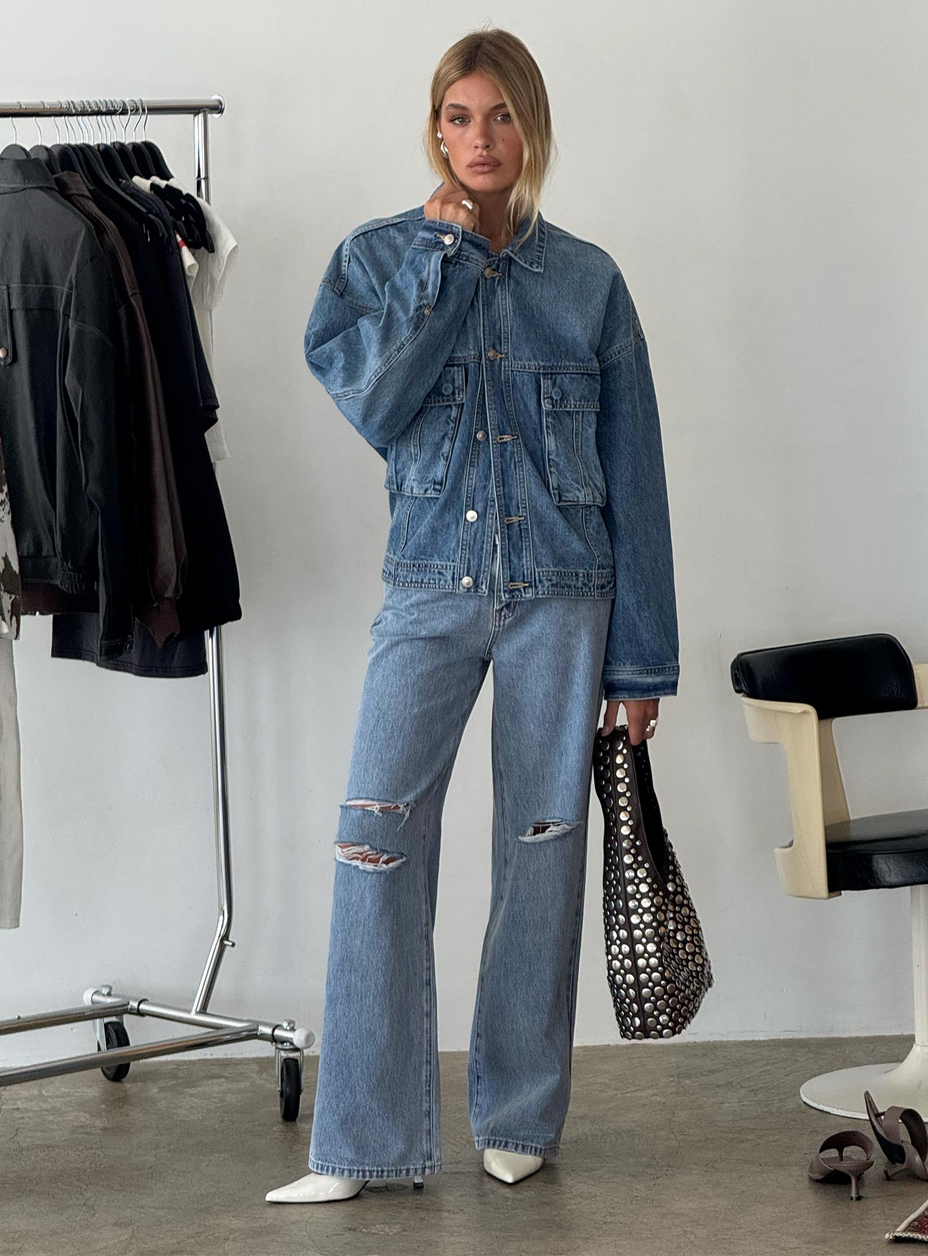 side view of model wearing Princess Polly Kadison Low Rise Straight Leg Jeans Mid Wash Blue Low Rise Jeans 