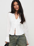 front view of model wearing Princess Polly Elowenn Long Sleeve Top White Full Sleeves V-Neck 