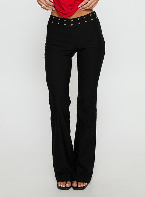 side view of model wearing Princess Polly Yevina Eyelet Flare Pant Black Low Rise Pants 