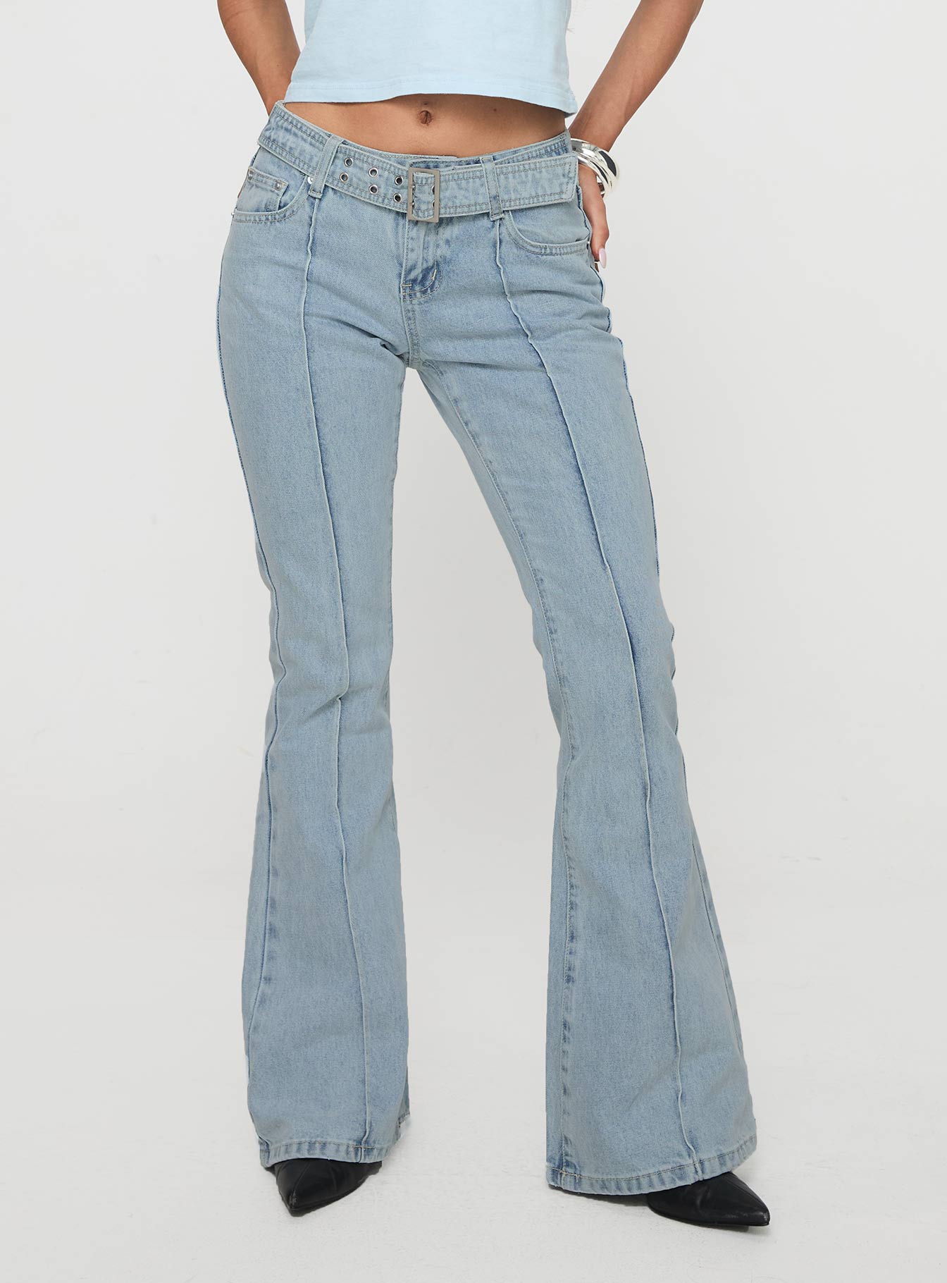 back view of model wearing Princess Polly Echovalley Low Rise Jeans Light Wash Mid Rise 